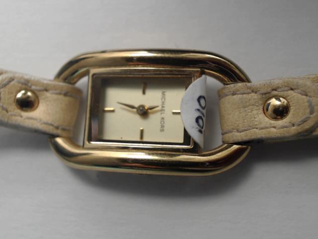 Montre gold tone cuir