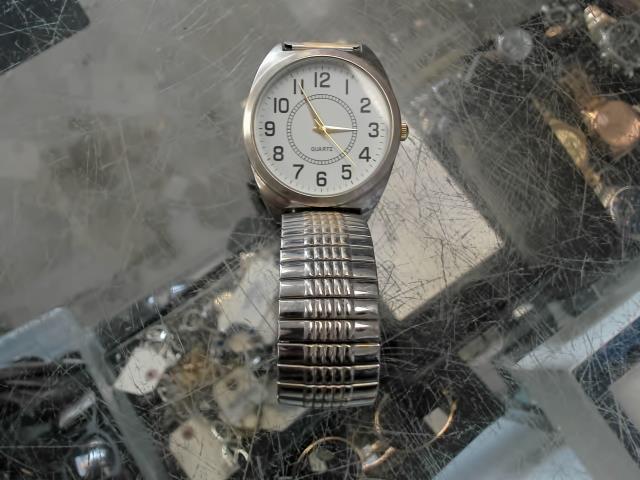 Montre argent et or bracelet elastic