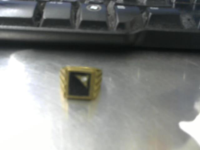 Fake gold ring with black front